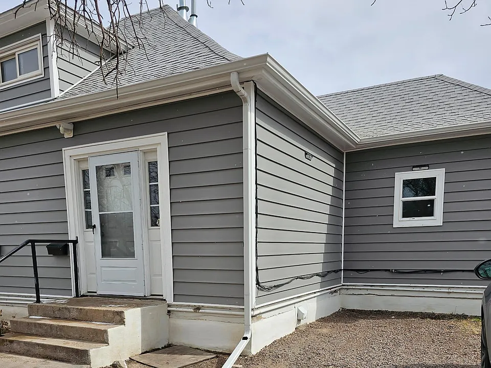 Front entrance and parking spot next to doorsteps