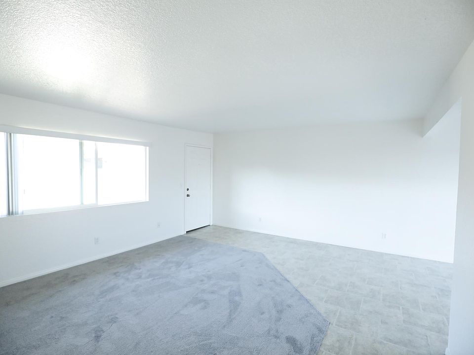 Front Entrance and Living Room with New Carpeting