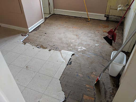 Kitchen floor has been refinished.