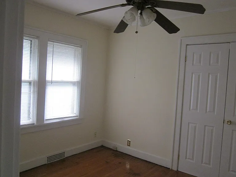 First downstairs bedroom. Double doors lead into living room.