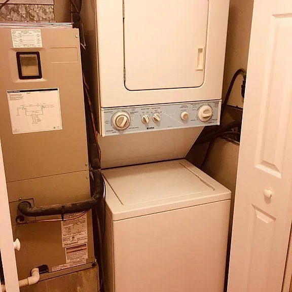 Laundry in unit next to bathroom