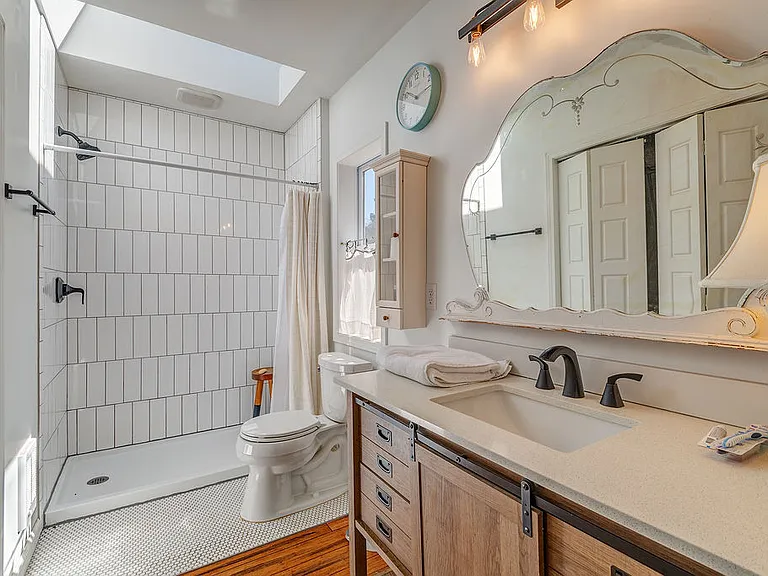 Primary bath just outside the door with easy walk in shower
