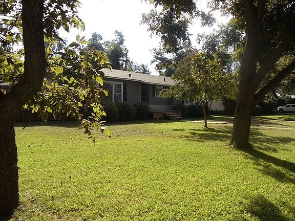 Mature pecan trees surround the property. 