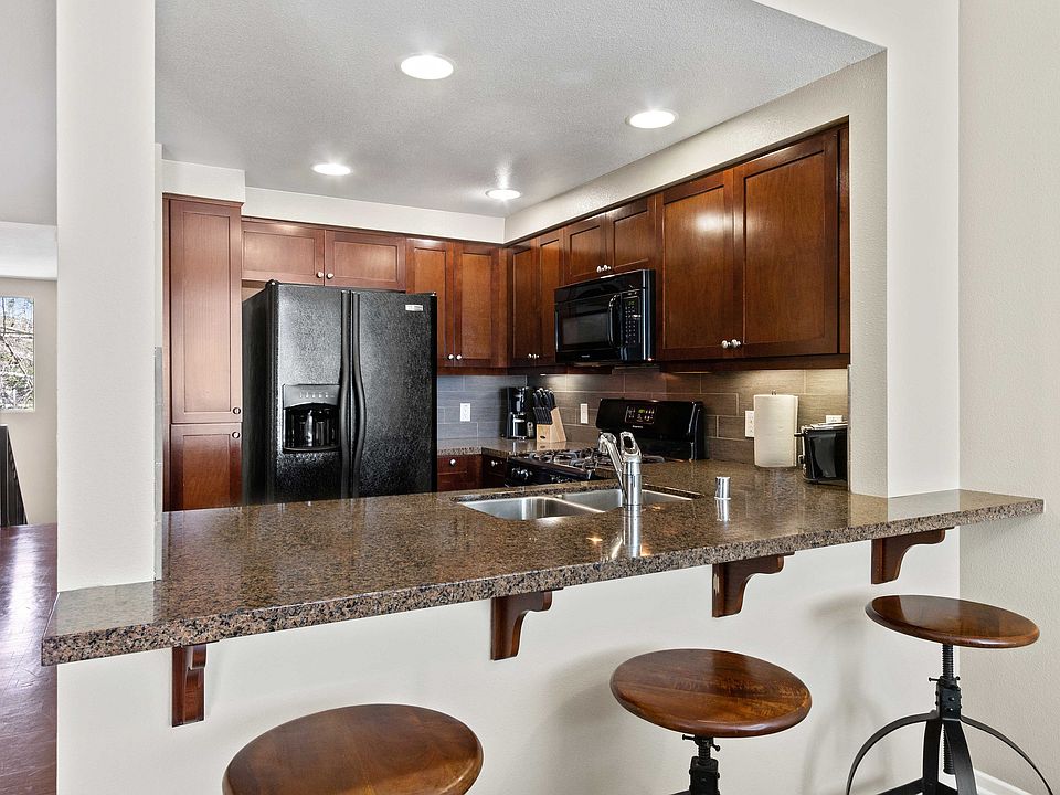 Kitchen with granite breakfast bar.