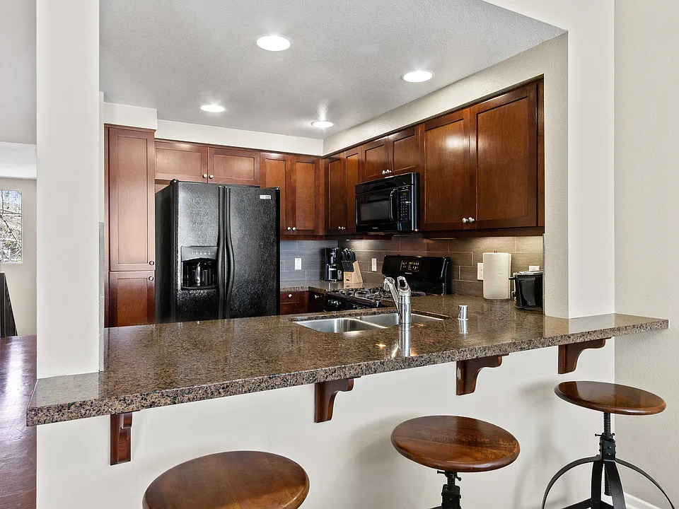 Kitchen with granite breakfast bar.