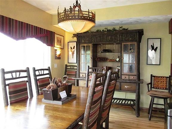 That table has extra boards in it to fill up the room! Zoom in on the chandelier! You are going to see cowboys and girls everywh