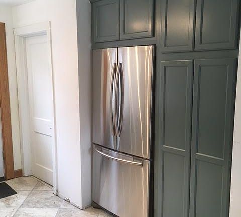 New kitchen with new refrigerator and new pantry cabinet