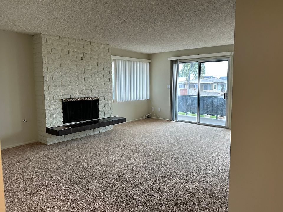 LIVING ROOM WITH BALCONY AND GAS FIREPLACE
