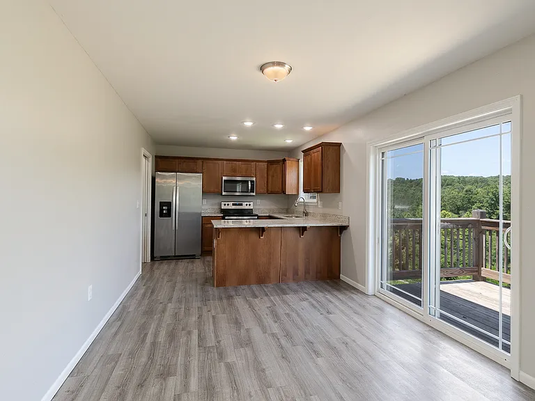 Sliding door access to Back Deck off of kitchen and dining area