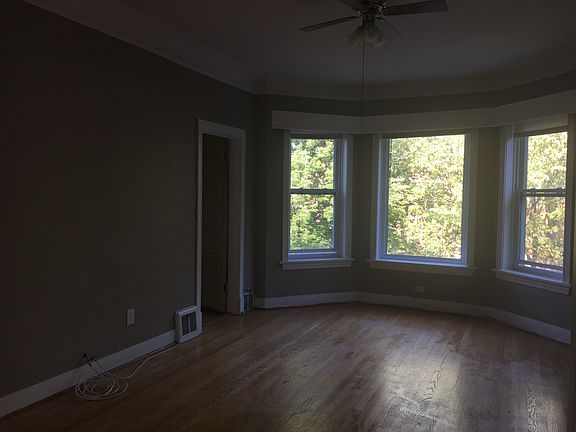 Living room area at front of house with lots of natural ligh