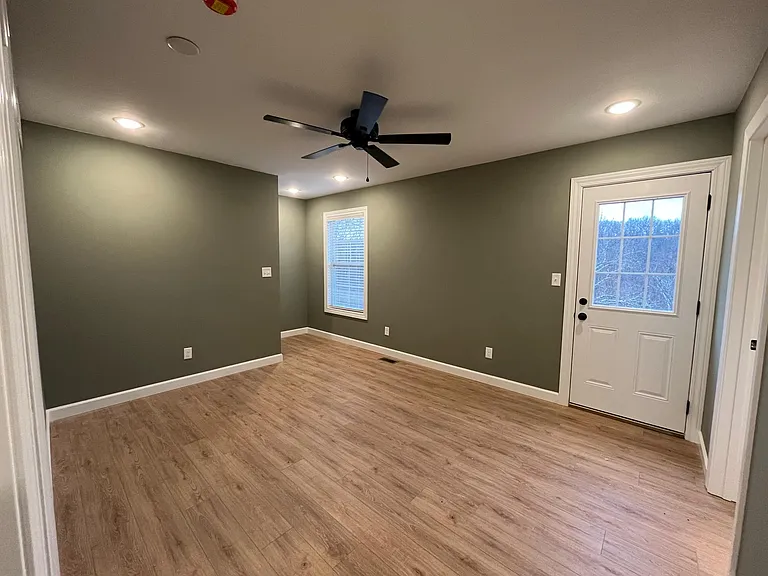 Second level living area with door leading to second upper balcony