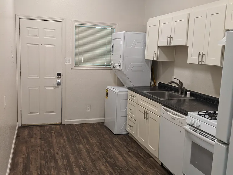 Kitchen with washer/dryer and dishwasher