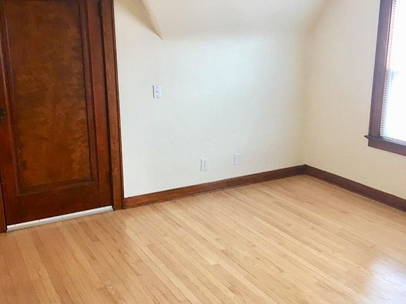 Living area with door to attic storage space