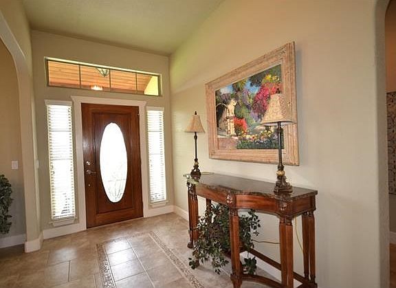 open foyer with custom front door
