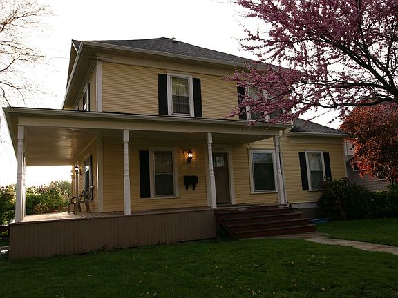 View of east entrance, wrap porch