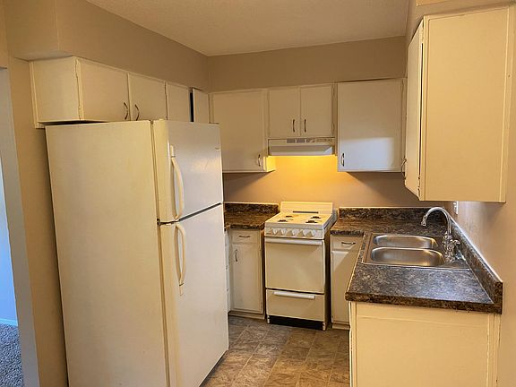 Fresh, clean, bright kitchen with plenty of storage space and lovely large dining area!