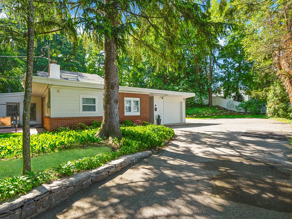 A sweeping, tree-lined driveway welcomes you to your private oasis.