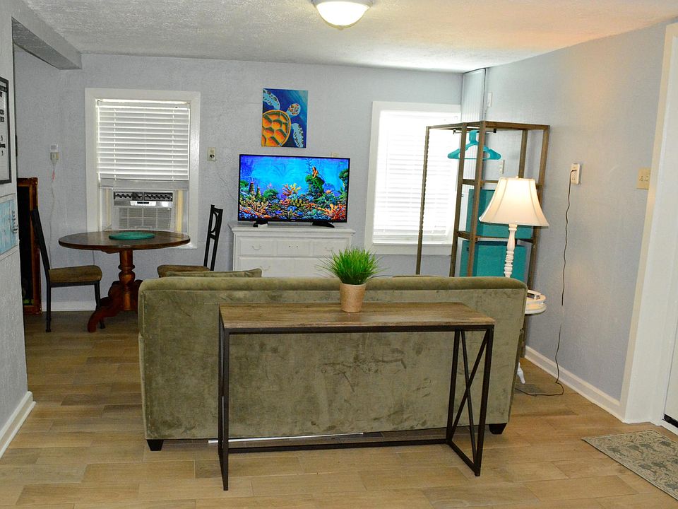 Comfy sofa for TV viewing. Dining table for great meals.