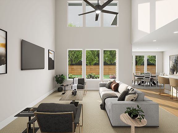 A modern, open-concept living space with a minimalist design, featuring large windows that allow nat