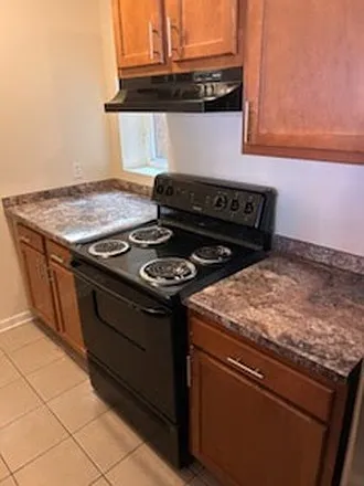 Vacant kitchen unit cabinetry and appliances