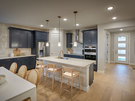 The Manzanita kitchen featuring built-in, stainless-steel appliances.