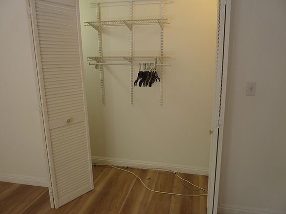 Living room closet, open.