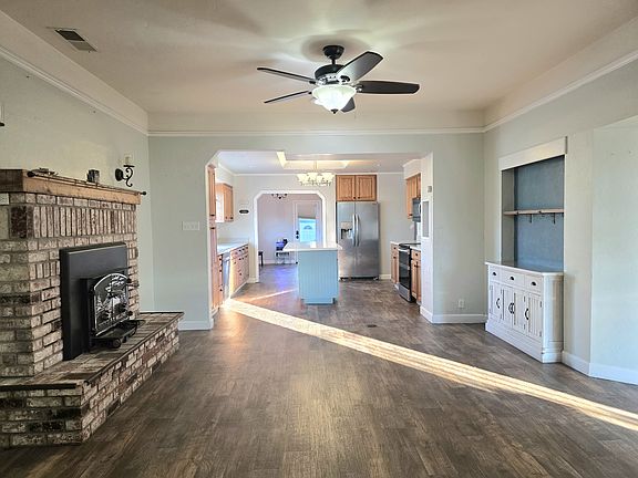Living room with Fireplace. Custom Laminate floors throught out the whole house.
