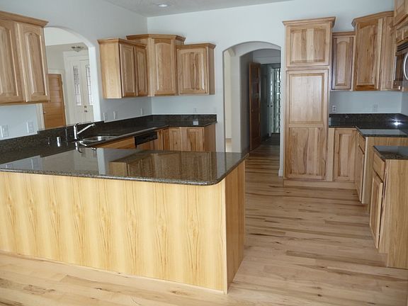 The circular floor plan of this gourmet kitchen adds extreme social and entertaining value. Best of 