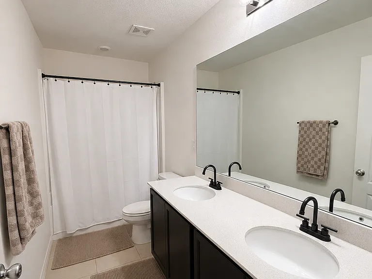 Full bath with double sink on second floor