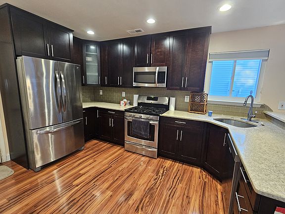 Updated kitchen with stainless steel appliances and Quartz countertop