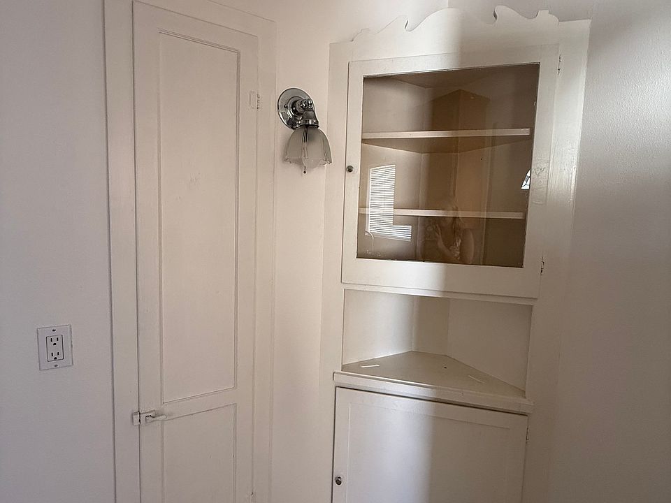 Corner cabinets with vintage light fixture