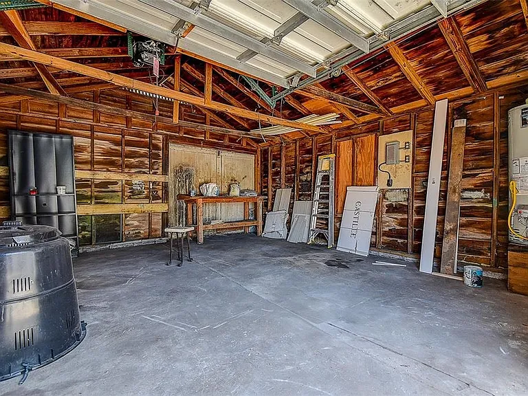 Enjoy a low-maintenance 0.13-acre lot with a 1-car detached garage, shed, and additional storage space.