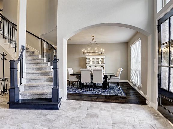 An elegant foyer with a rotunda entry and grand staircase will make a fabulous first impression. This home is filled from front to back with elegant decorator touches.