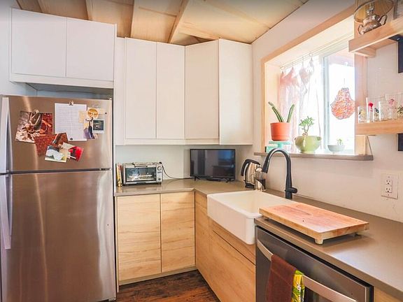 Stainless steel appliances, Farmhouse sink, new cabinetry and full size microwave behind in cabinet (not pictured)