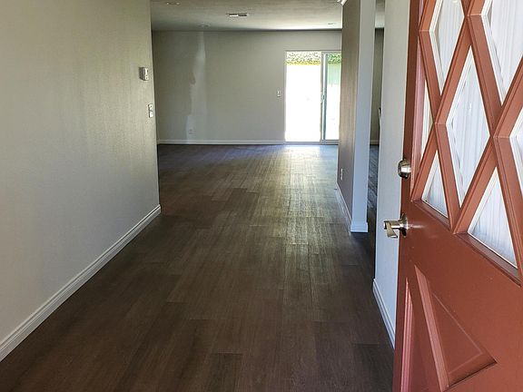 Entry looking into large living room, all new flooring