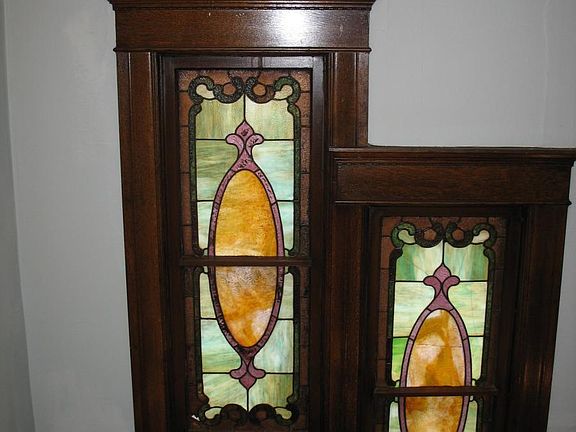 windows in stairwell leading to apartment