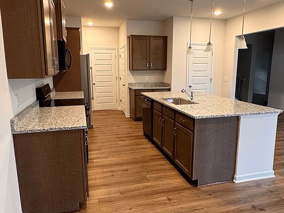 kitchen with large granite top island