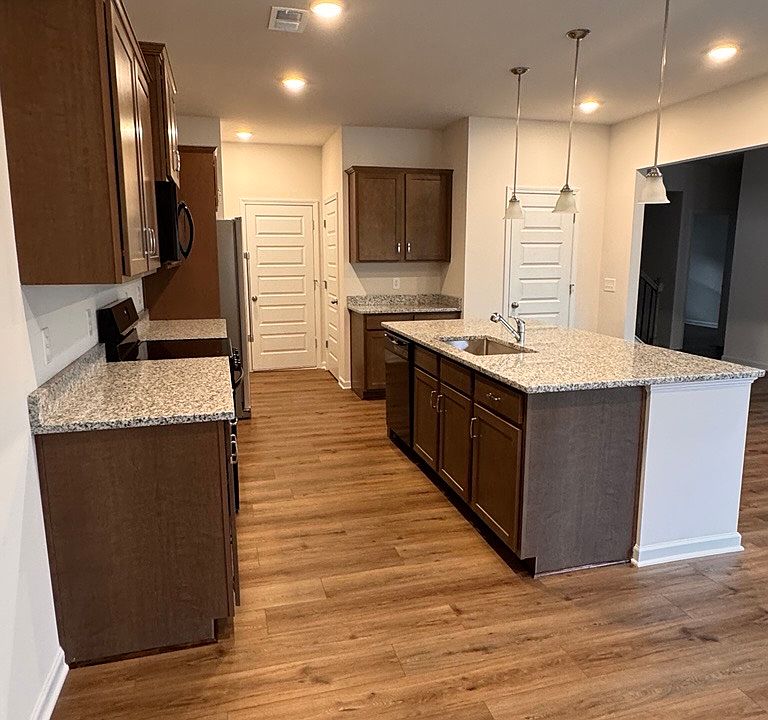 kitchen with large granite top island
