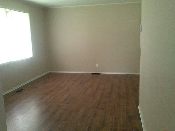 Beautiful laminate flooring in living/hallway!