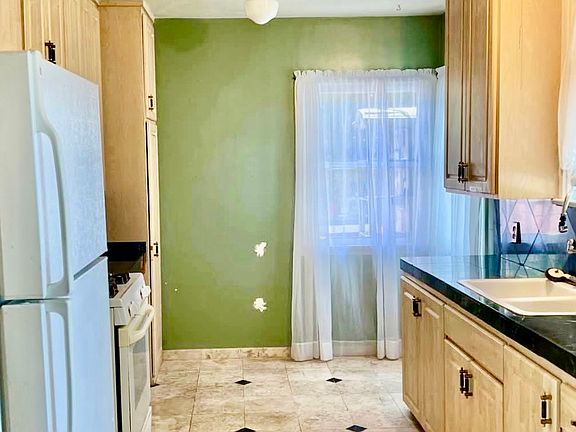 Kitchen with custom travertine tile flooring