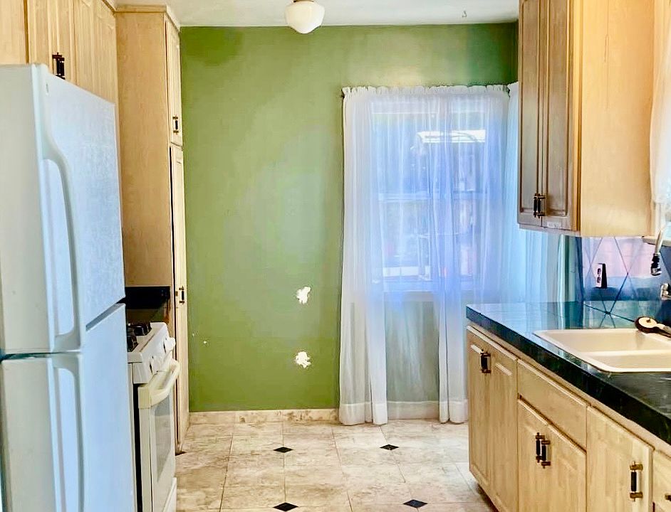 Kitchen with custom travertine tile flooring