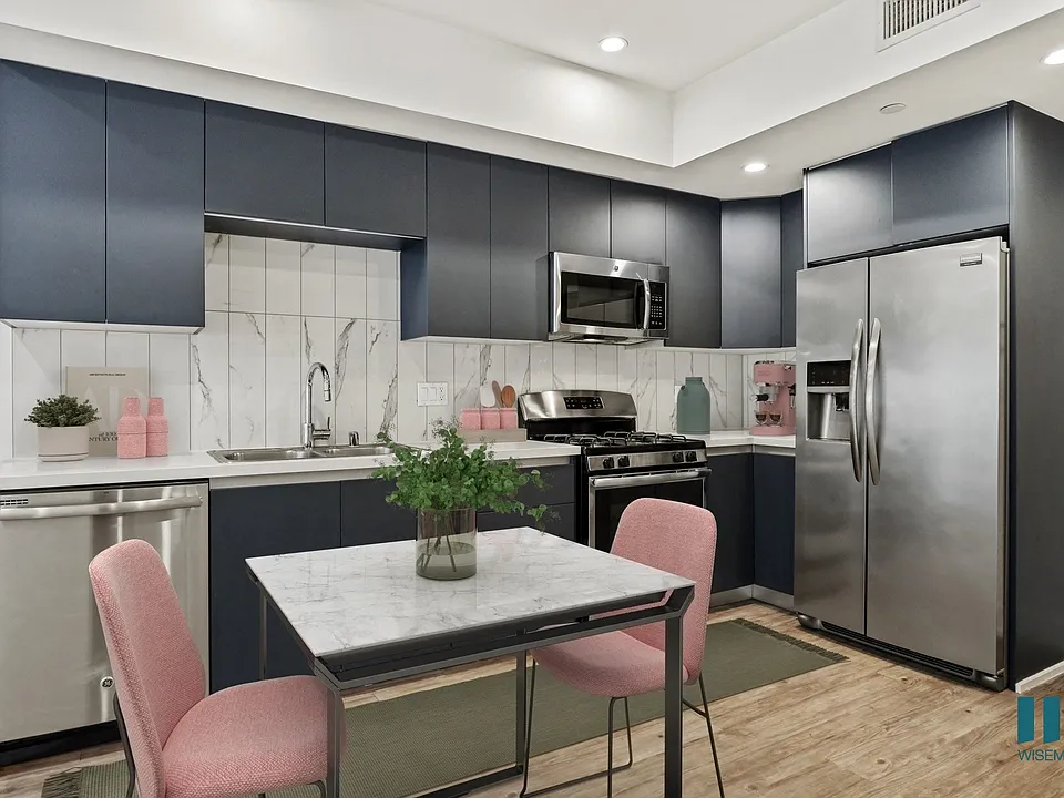 Kitchen with Stainless-Steel Refrigerator, Dishwasher, Stove, and Microwave Oven