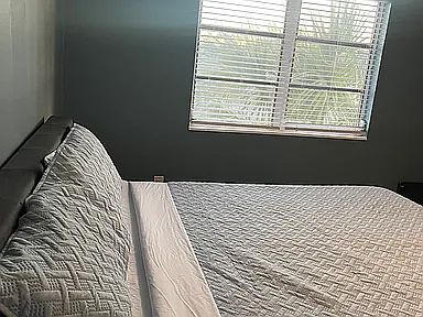 Primary bedroom w/ king bed featuring a brand new memory foam mattress. Room darkening shades being added for added sleeping comfort.