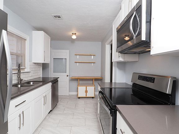 Whirlpool appliances:
 Ice maker
 Electric stove
 Microwave
 Dishwasher

Quartz countertops
Shaker style cabinets