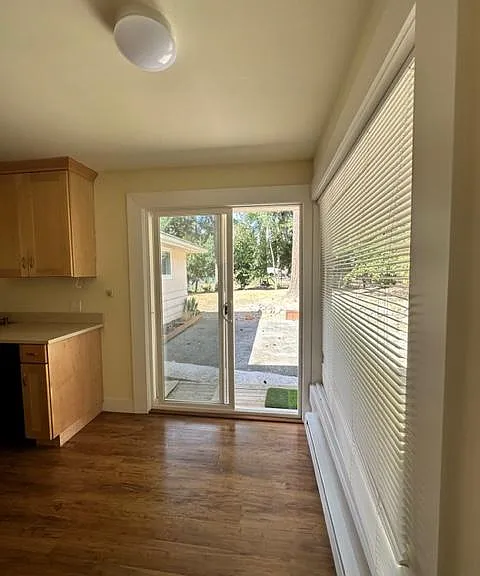 Kitchen nook opens to large yard