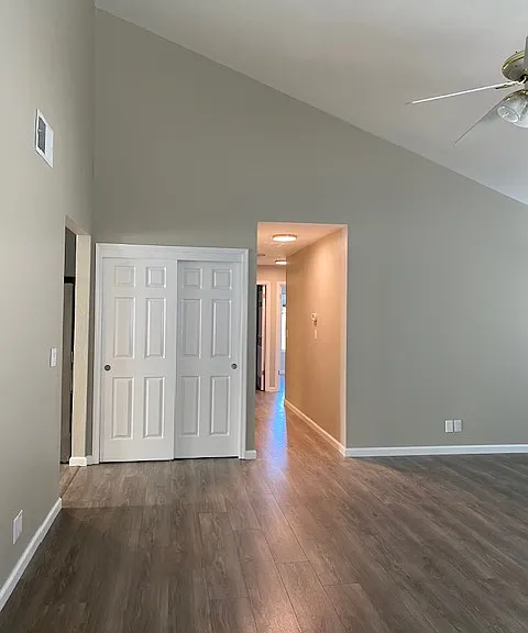 Large living room with vaulted ceilings and wood burning fireplace