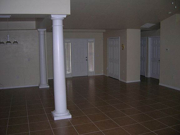 Open Foyer with trey ceiling, as is the Formal Dining Area