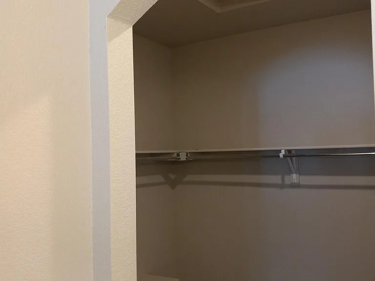 Archway into master walk in, more space around the corner.