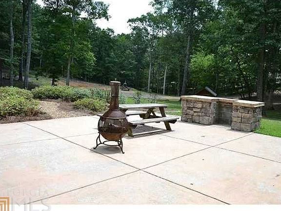 Incredible patio features stacked stone built-in grill - perfect for grilling, dining, relaxing & entertaining!