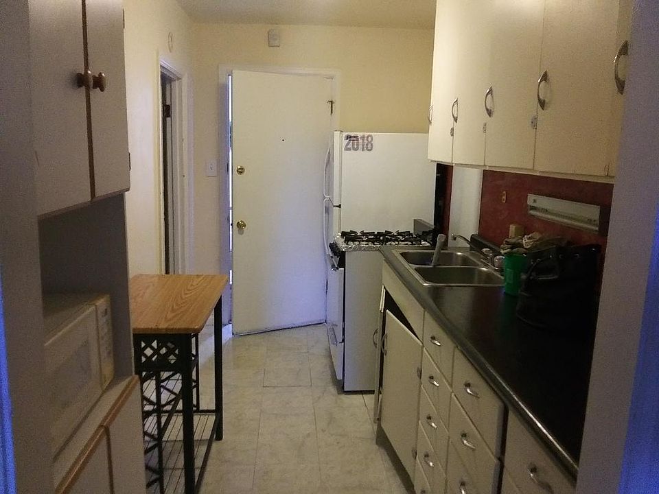 Kitchen and entry. Bedroom door to the left.